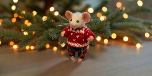 Leo is a gentle, handmade needle-felted mouse crafted from natural wool with tiny details and a warm, whimsical expression.