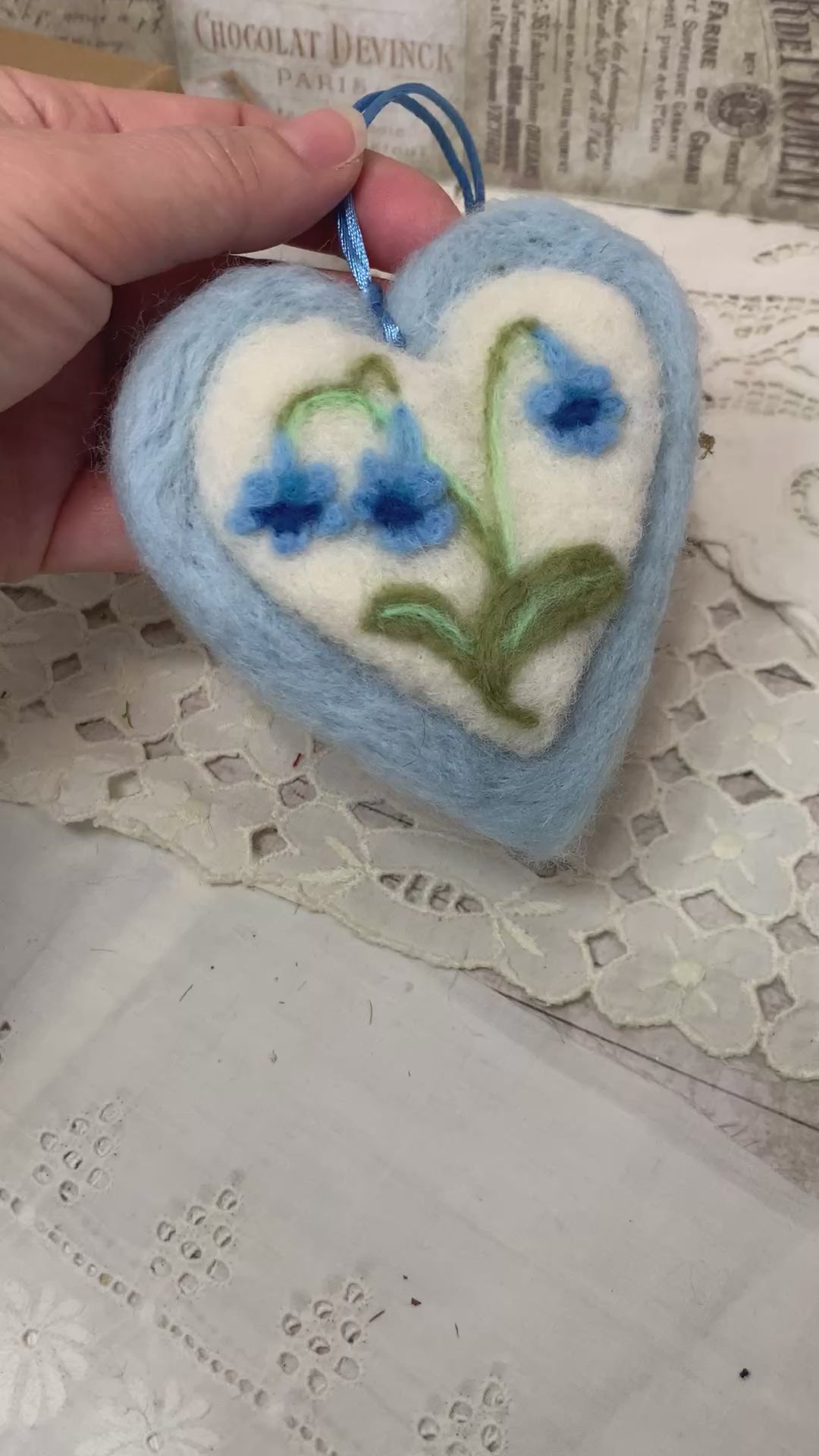 This handmade needle-felted heart is delicately embroidered with a bluebell flower, a timeless symbol of gratitude, humility, and quiet devotion.